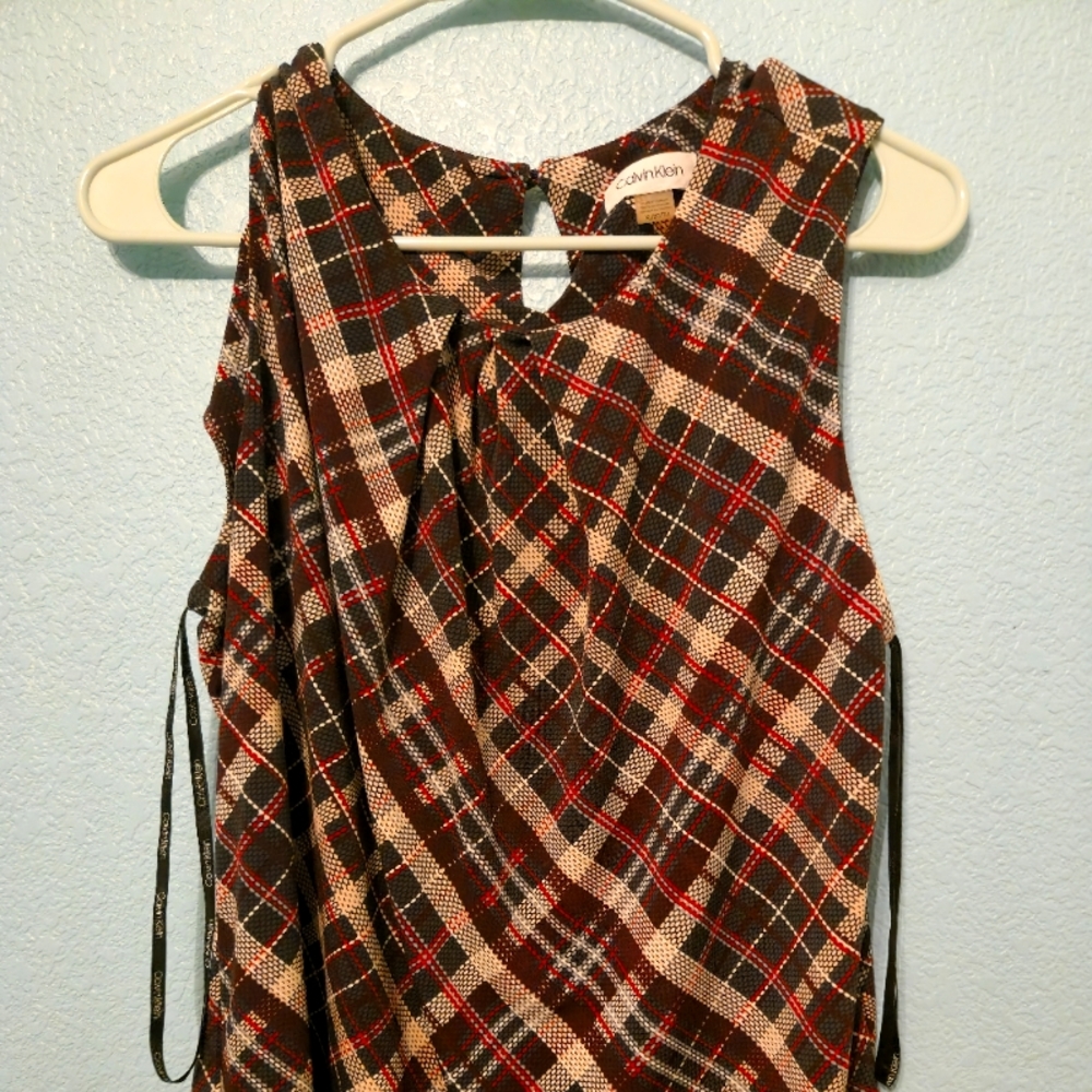 Sleeveless but says business